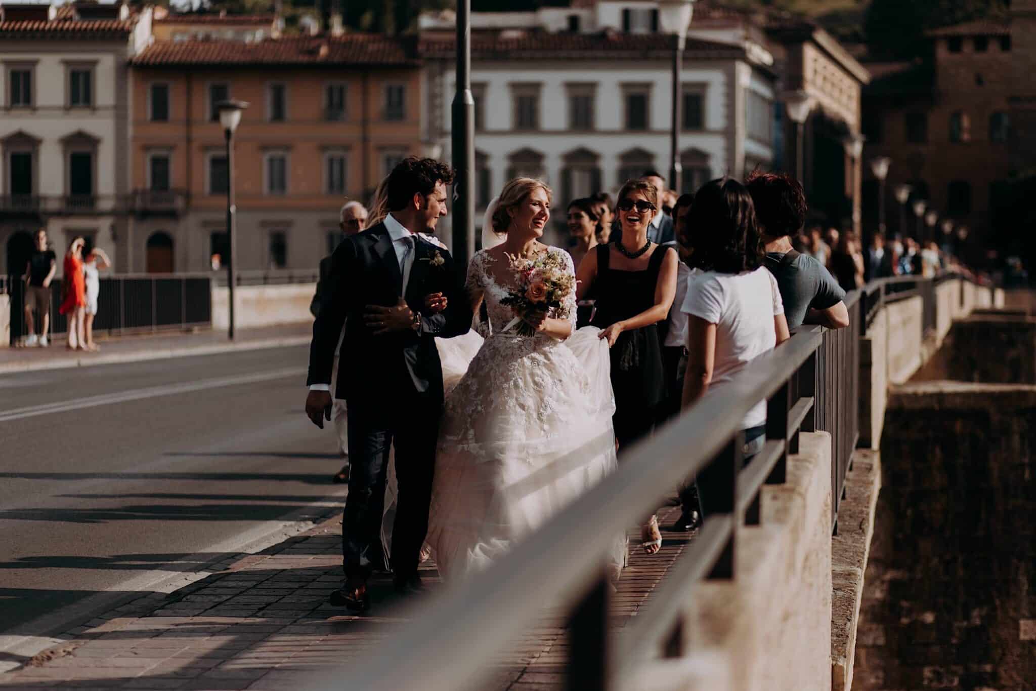 Newlyweds parade with friends in Florence